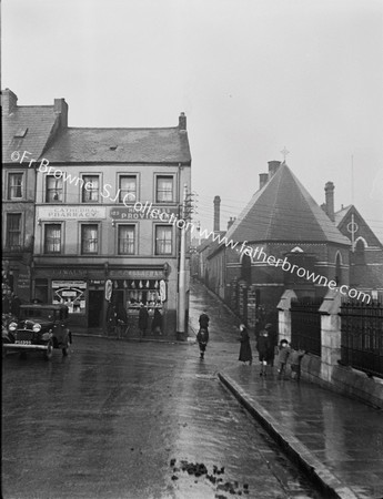 WET DAY OUTSIDE CATHEDRAL WALSH'S PHARMACY